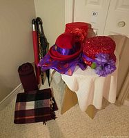 Overall view of hats on table, umbrellas, blankets