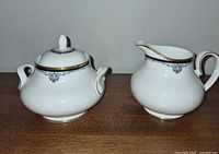 Creamer and lidded sugar bowl front view