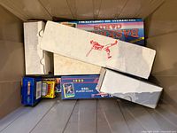Plastic tote view showing several white storage boxes, 1989 Score collector set box, Topps collector set box, small wax pack boxes