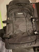 Front view showing brand logo, pockets, compression straps