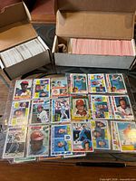 overall view showing both long boxes filled with cards and binder pages laid out