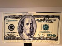 Full view of towel showing $100 bill print and Ft. Lauderdale text