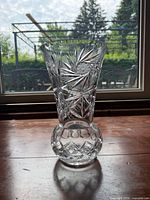full view of vase front, showing cut pattern and base