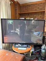 Front view of LG 60" flat-screen TV on table