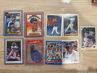 Nine featured cards including multiple Ken Griffey Jr. issues laid out, some in top loaders