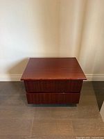 Front view of square mahogany nightstand