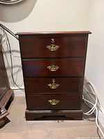 Front view showing overall cabinet, finish and drawer layout