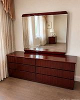 Front view of dresser with mounted mirror