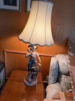 Full lamp with shade on side table