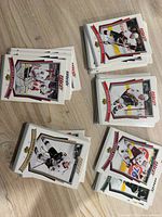 Multiple stacks of 2007-08 Upper Deck MVP hockey cards displayed on table