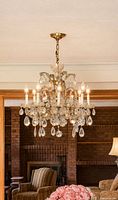 Installed view of chandelier lit