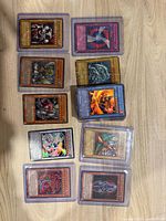 Group shot of all toploader-protected cards