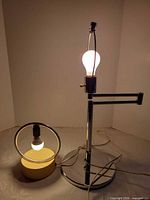 Both lamps illuminated showing design and size difference