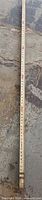 Full length view of ruler retracted to 6 ft showing measurement markings