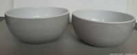 Side view showing two gray exterior stoneware bowls
