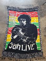 Full view of tapestry with border and fringe visible