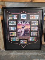 Full view of framed Super Bowl XLIX collage showing frame, mat, and ticket layout