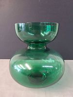 Front view of green glass vase showing overall form and color