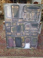 Full front view of entire painting on rug and workshop background