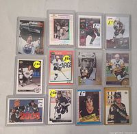 Front view of all 12 sleeved cards