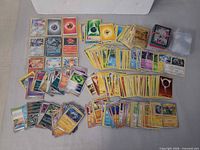 Full layout showing all card stacks, sleeves and deck box