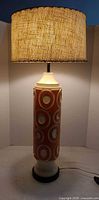 Full view of lamp showing base, neck, shade and power cord