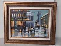 Full view of framed acrylic city street scene painting