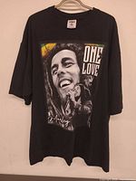 Front view showing full Bob Marley One Love graphic and overall shirt condition