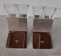 Front view of both metal holders with glasses inserted