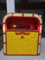 Front view of Bing Crosby Junior Juke record player powered on
