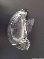 Top view of clear crystal trinket dish showing interior scratching