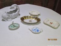 Group shot of all six porcelain and ceramic items
