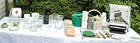 Full table showing All-Clad grill, jars, salad spinner, utensils