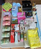 Overall view of perfumes, soaps, cloths, slipper socks and accessories on table