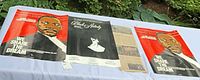 Overall view of two MLK posters, Black Nativity program, and magazine article laid out on table