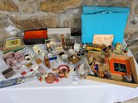 Overall lot on table showing furniture, toys, books, boxes