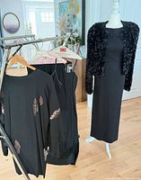 Rack and mannequin showing all five black garments together