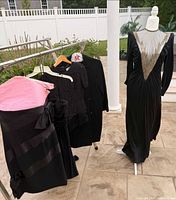 Overview of all four garments on rack and mannequin