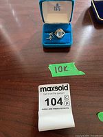 Ring and earrings in blue velvet Birks box on tabletop
