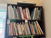 Three shelves filled with assorted art and nature books