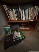 Books on upper shelf, various titles visible