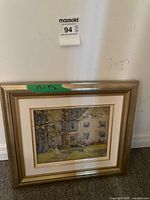 Front view of framed painting showing artwork, mat and frame