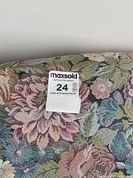 Close-up of upholstery with MaxSold lot sticker