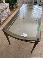 Full view of rectangular glass-top coffee table
