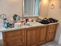 Full countertop view with all toiletries and styling electronics