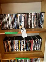 Two shelves filled with DVD cases