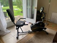 Full side view of Marcy recumbent exercise bike showing seat, backrest, frame, pedals, and display