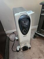 Front view showing control panel, knobs, brand logo, power cord