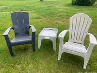 Overall view of two chairs and table on lawn