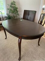 Full view of oval dining table with no leaves inserted